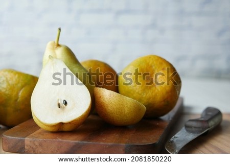 slice of fresh pears on table close up 