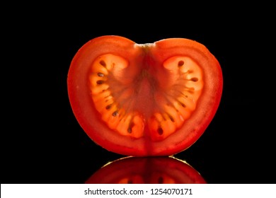 Slice Of Fresh Ripe Tomato Isolated On Black