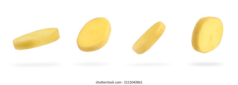 A slice of fresh unpeeled potatoes falls on a white background. A set of chopped raw potatoes. Food levitation concept. High resolution image