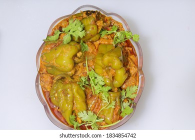 Slice Of Green Bell Pepper Or Capsicum Curry Isolated On White Background