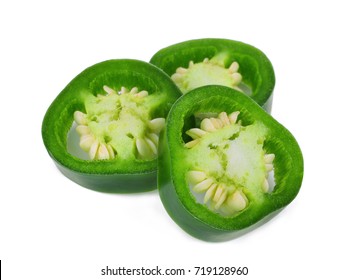 slice of green jalapeno peppers isolated on a white background