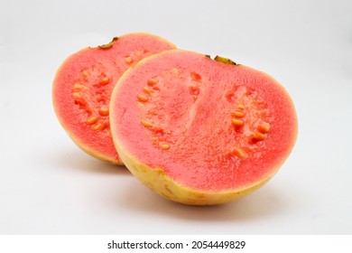 Slice Of Guava Tropical Fruit In Fresh Red Colour. Isolated White Background Of Healthy Diet Food With Less Calories 