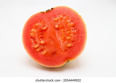 Slice Of Guava Tropical Fruit In Fresh Red Colour. Isolated White Background Of Healthy Diet Food With Less Calories 