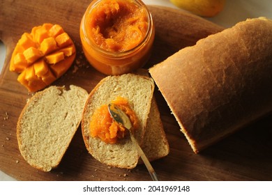 Slice Of Home Baked Wheat Bread With A Spread Of Home Made Alphonso Mango Jam. It Is A 3 Ingredient Jam With Mango Pulp, Sugar And Lime Juice. Alphonso Is The Tastiest Mango In India