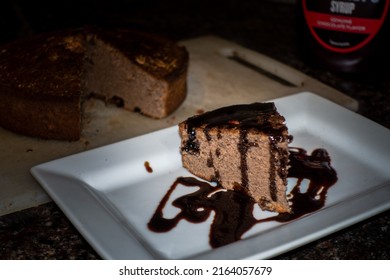 A Slice Of Home Made Cinnamon Cake With Melted Chocolate On Top. India