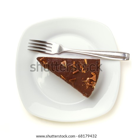 Slice of homemade Chocolate Cake isolated on white viewed from above.