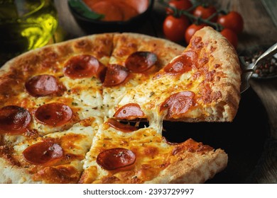 A slice of hot Italian pizza with stretching cheese. Pizza pepperoni on a dark wooden background - Powered by Shutterstock