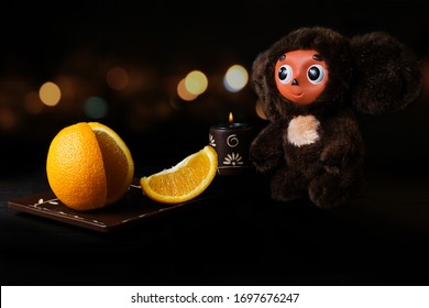 A slice of juicy orange for a Cheburashka toy to boost up energy and immune system with vitamin C 