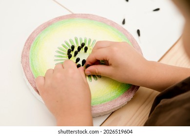 Slice Of Kiwi Fruit. DIY Home Made Paper Toy. Seeds Made Of  Black Painted Cotton Buds. Activities At Home. Insert The Pin. Implement For Special Needs Children And Fine Motor Activities For Preschool