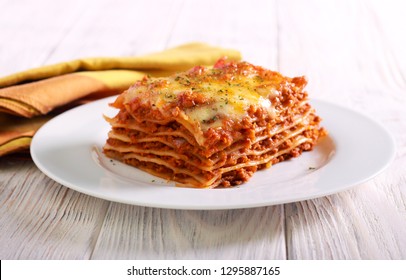 Slice of lasagna  on plate selective focus