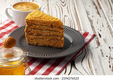 Slice Of Layered Honey Cake On Plate