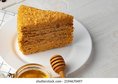 Slice Of Layered Honey Cake On Plate