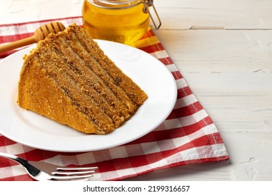 Slice Of Layered Honey Cake On Plate