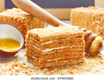 Slice of layered honey cake selective focus