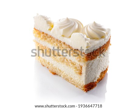 slice of layered sponge cake with whipped cream decoration close-up isolated on white background 
