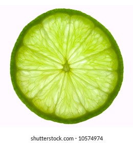 Slice of lime, backlit and isolated on white.