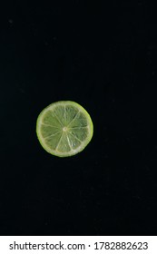 slice of lime on a black background