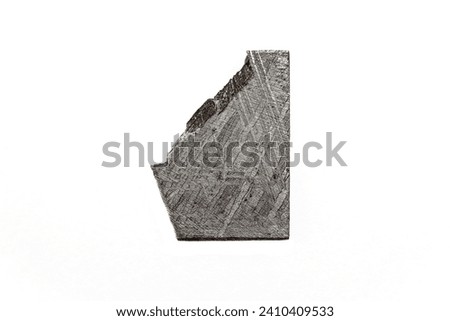 Slice of meteorite with etched texture