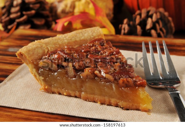 A slice of pecan pie with a festive autumn,\
Thanksgiving background