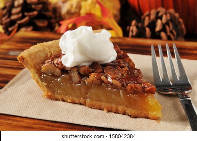 A slice of pecan pie on a holiday setting