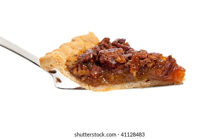 A Slice Of Pecan Pie On A White Background