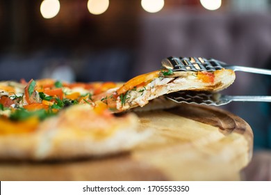 
slice of pizza closeup, selective focus. Take pizza with tongs.