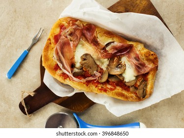 Slice Of Pizza Over Greaseproof Paper