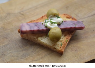 Slice Of Port Wine Derby Cheese White Seeded Bread And Olives