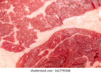 Slice Of Raw Beef Steak Close-up, May Be Used As Background Or Texture Of Beef Meat