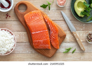 Slice Of Raw Salmon Fillet On Wooden Cutting Board, Preparation Asian Fish Dish, Top View