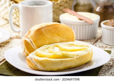 slice of salt bread cut with butter, called French bread in Brazil, Brazilian breakfast - Shutterstock ID 2034697598