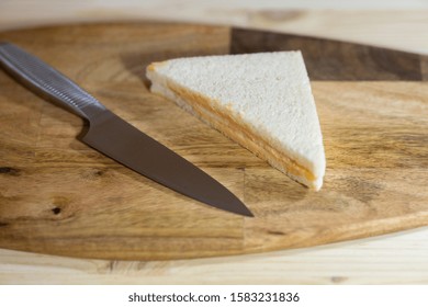 a slice of sandwich and sharp knife