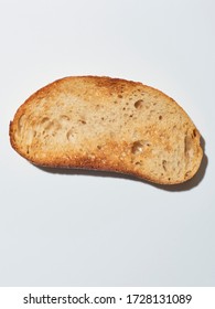 Slice Of Sourdough On White Surface