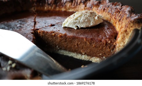 A Slice Of Spiced Pumpkin Pie In The Tin.