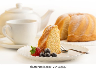 Slice Of Sponge Cake And White Porcelain