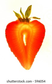 Slice of strawberry backlit.