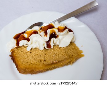 Slice Of Tasty Sweet Sponge Cake With Delicate Mascarpone Cream And Coffee Syrup..