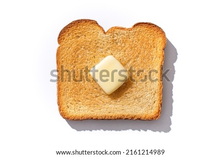 Slice of Toasted Bread With Pad of Melting Butter and Hard Shadow Flat Lay Top Down View - Isolated on White Background