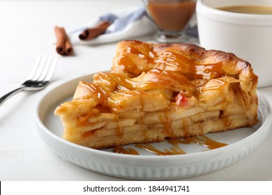 Slice Of Traditional Apple Pie On White Wooden Table, Closeup