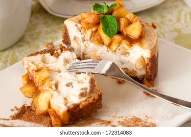 Slice of vanilla cheesecake decorated with apple topping - Powered by Shutterstock