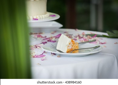 A Slice Of A Wedding Cake On Dish.