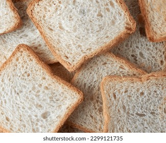 slice of white bread in full frame, popular food item in many cultures and used for making sandwiches, toast, and other dishes, lighter color and softer texture food background