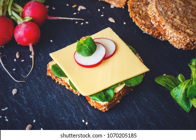 Slice Of Whole Grain Bread With Cheese, Salat And Radish