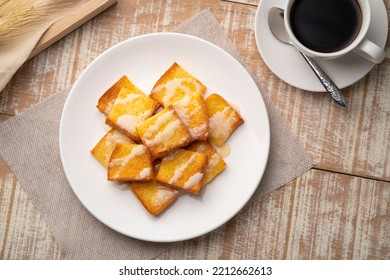 Sliced Air Fryer Grilled Butter Toast,golden Brown Crispy Bread Topped With Sugar And Sweetened Condensed Milk On White Plate