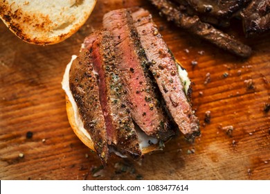 Sliced Angus Steak With Garlic Butter, Served On Bun With Horseradish Sauce