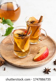 Sliced Apple Summer Drink. Refreshing Apple Juice With Cinnamon, Clove And Anise Stars. White Background. Cold Beverage. 