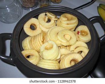 Sliced Apples In Crock Pot On Kitchen Counter