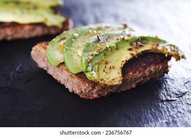 Sliced Avocado On Toast Bread With Spices