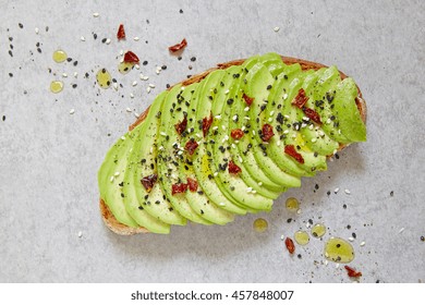 Sliced Avocado On Toast Bread With Spices