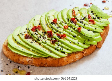 Sliced Avocado On Toast Bread With Spices